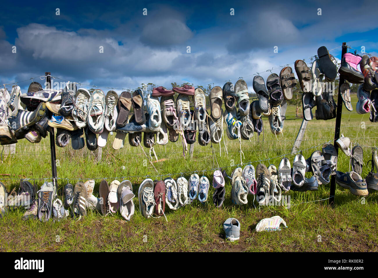Shoes Hanging on Fence Stock Photo Alamy