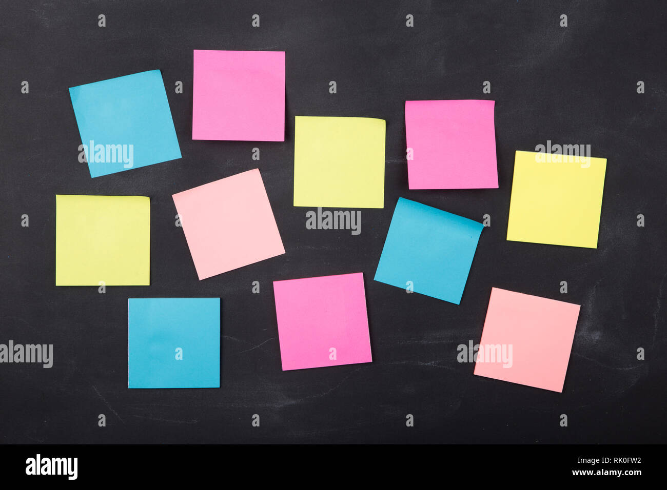 Colorful sticky notes on the blank blackboard Stock Photo