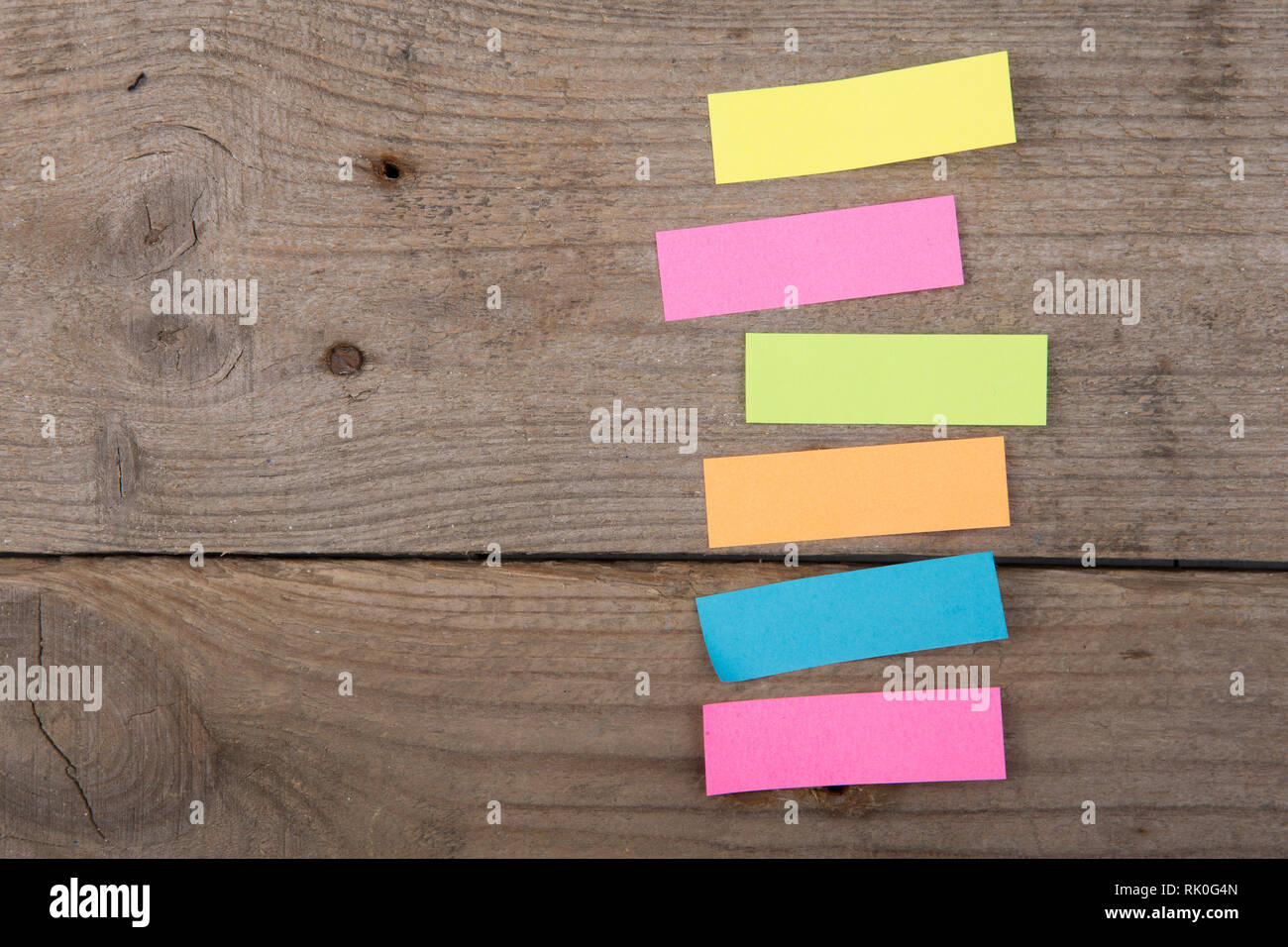 Colorful sticky notes on the wooden board Stock Photo