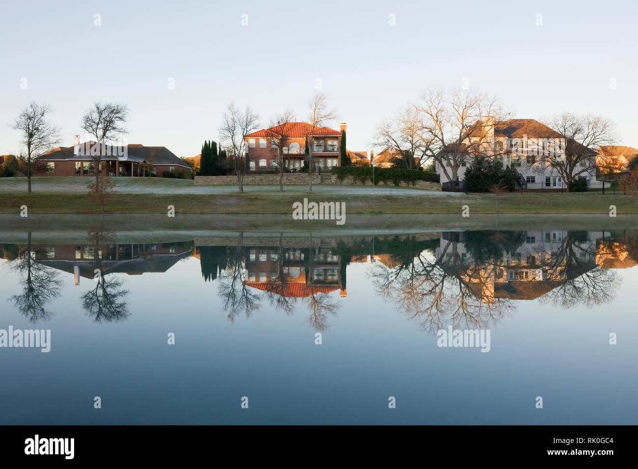 Houses on Large Pond Stock Photo Alamy