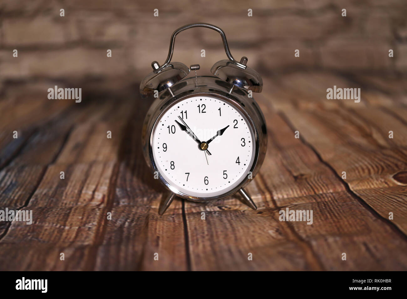 The old alarm clock on a light background Stock Photo