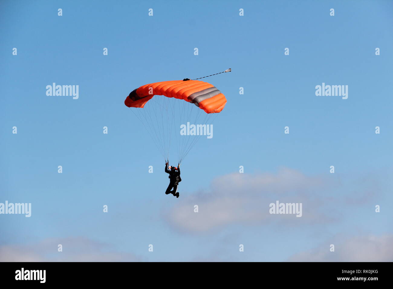 The paratrooper / The paratrooper descends to the ground Stock Photo