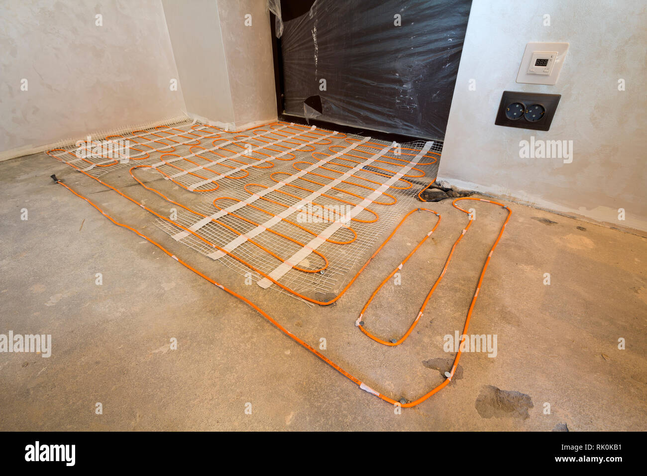 Heating Red Electrical Cable Wire System Installed On Cement Floor