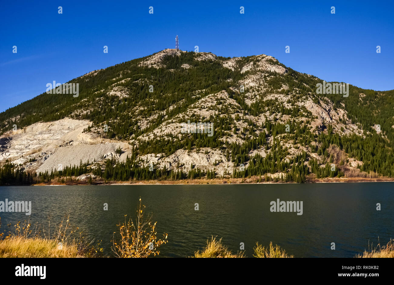 Crowsnest Pass Lake and surrounding mountains Stock Photo