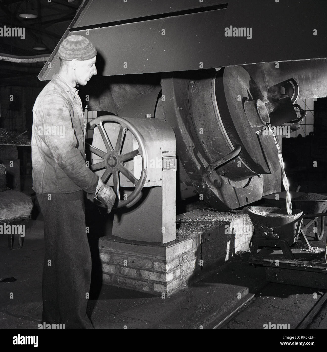 1950s, historical, male working in a factory manufacturing zinc-carbon ...
