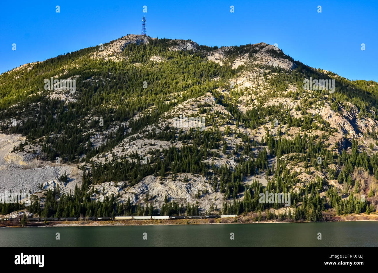 Crowsnest Pass Lake and surrounding mountains Stock Photo