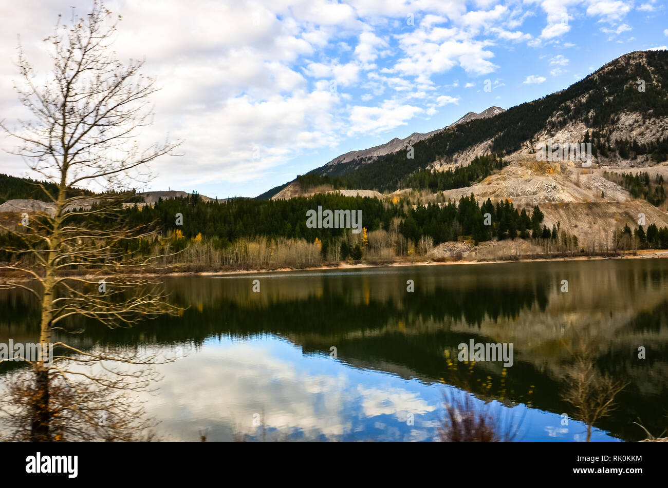 Reflection of mountains at Crowsnest Pass Lake Stock Photo
