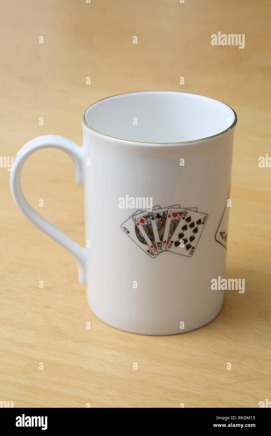 Sheltonian Bone China Mug Decorated with Playing Cards and Gold Rim Stock Photo