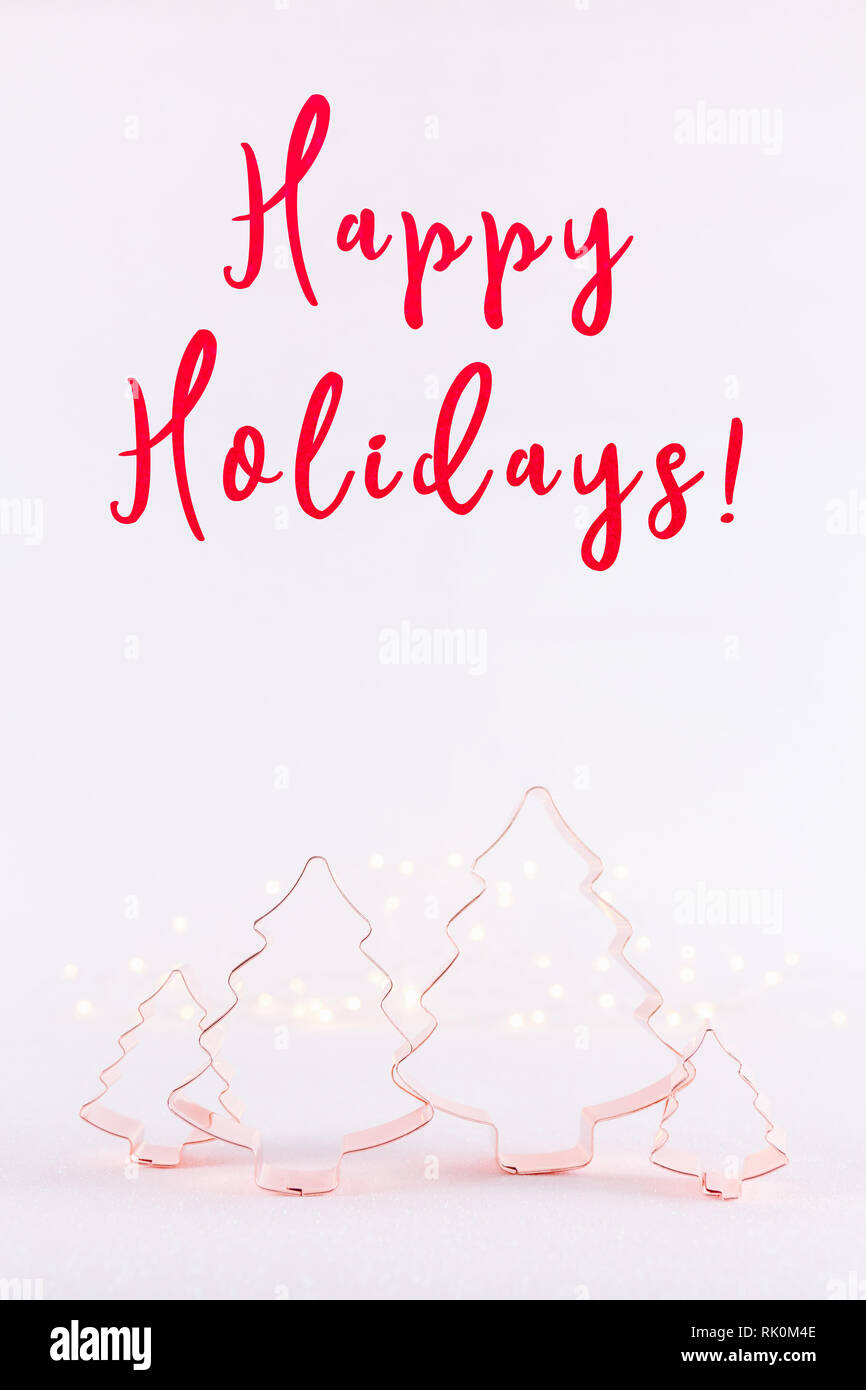 Family of Christmas Tree Copper cookie cutters on white sparkling