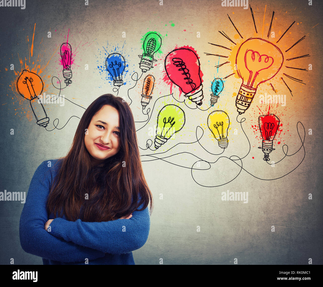 Young creative woman has great ideas as colorful light bulbs over head. Smart and ingenious girl different thinking, genius solutions concept. Alterna Stock Photo