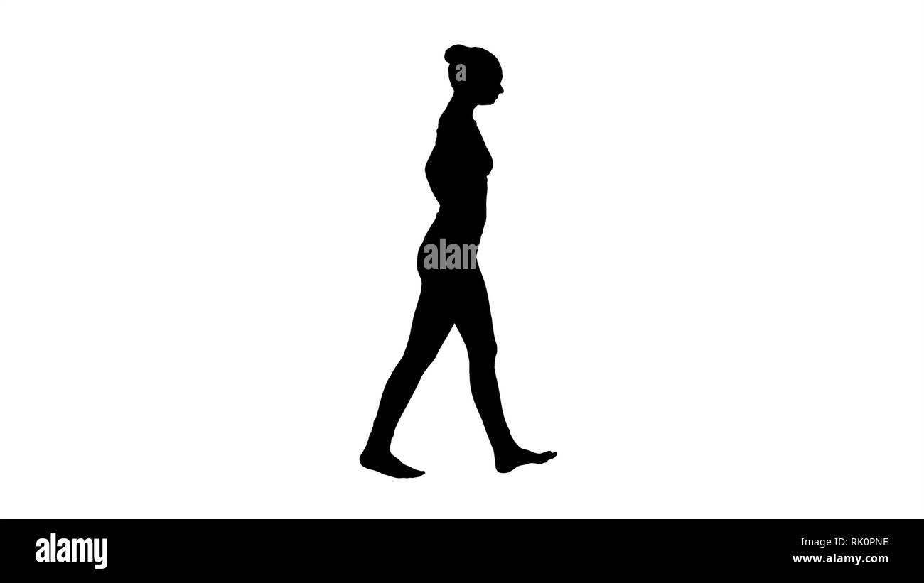 Silhouette Beautiful young woman stretching her neck walking Stock ...