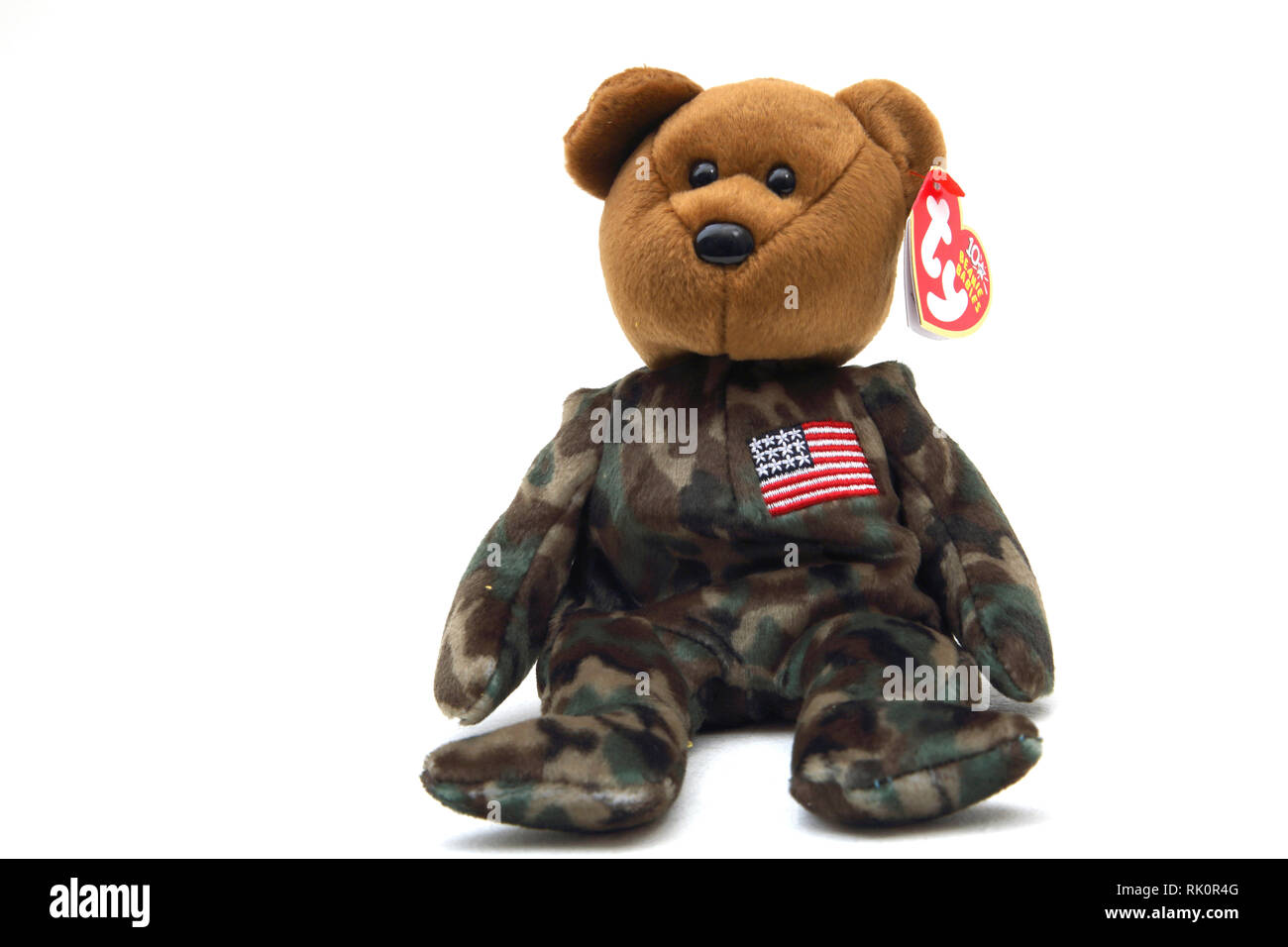 TY Beanie Baby Soldier Bear Wearing Camouflaged outfit with American Flag on Chest Stock Photo