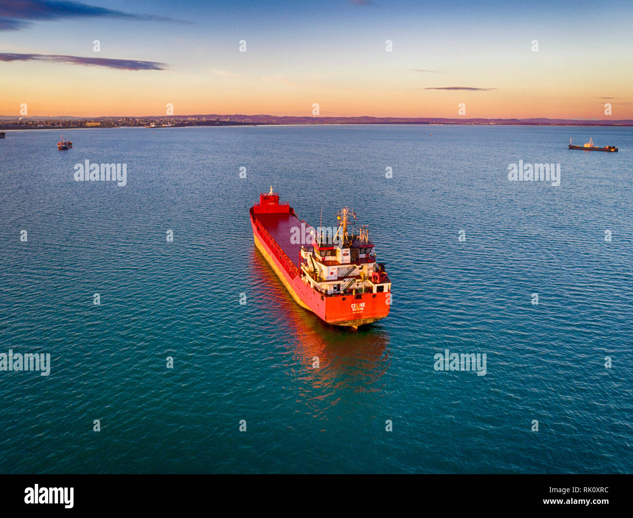 Aerial view of beautiful large ship at sunset. Colorful landscape with boat, sea, colorful sky. Stock Photo