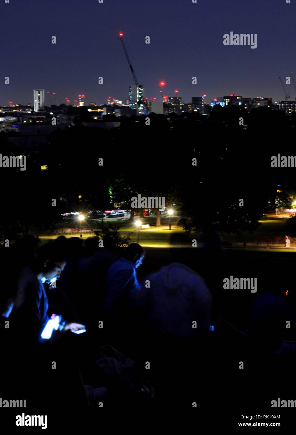 People on Primrose Hill by night, London, UK. Stock Photo