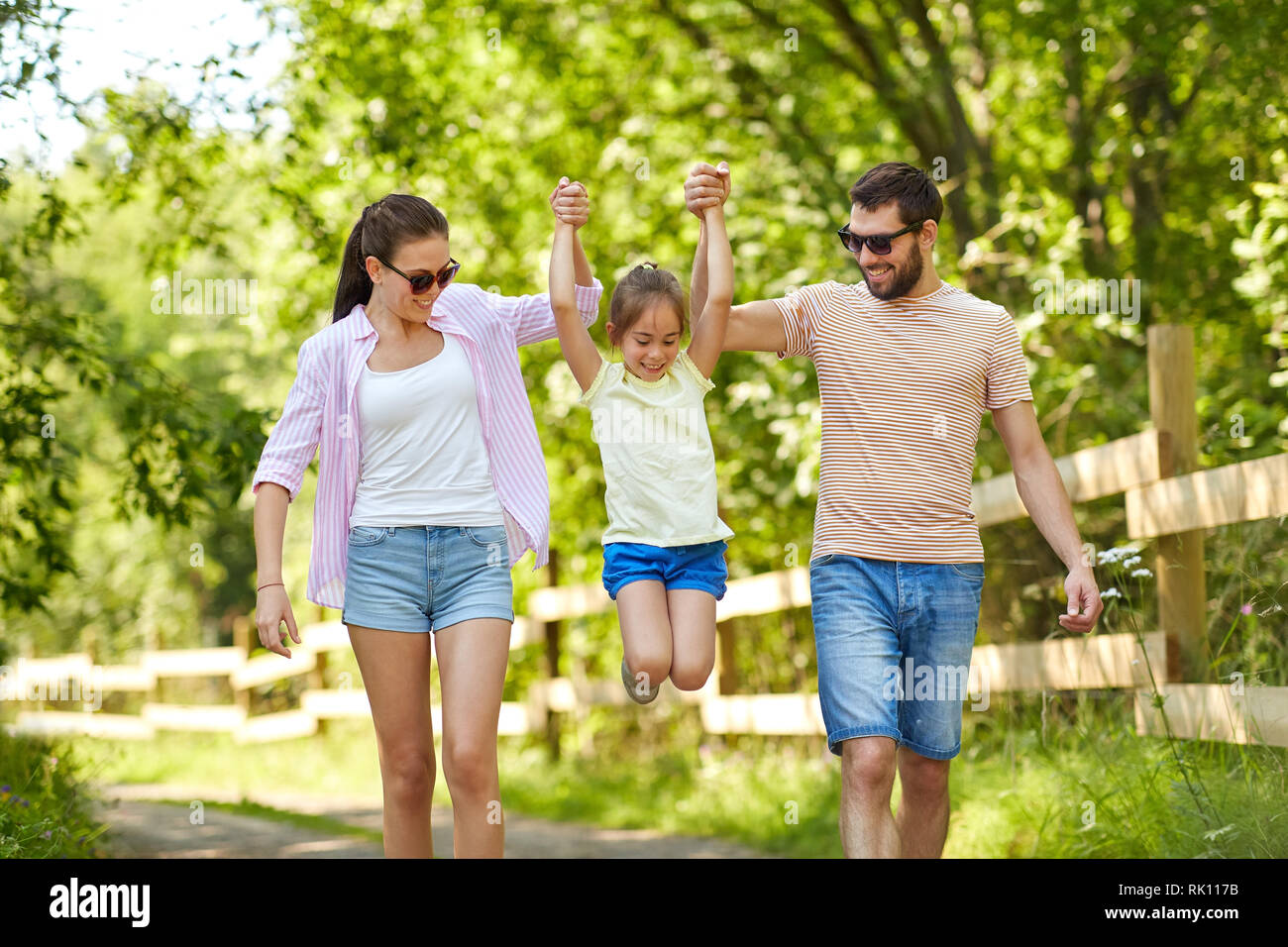 happy family walking in summer park Stock Photo - Alamy