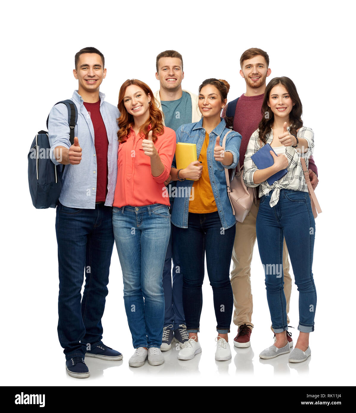 group of smiling students showing thumbs up Stock Photo - Alamy