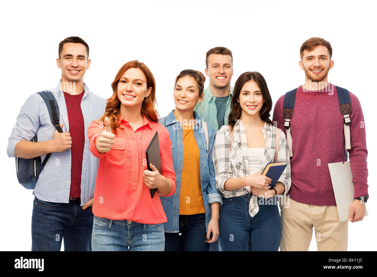 group of smiling students showing thumbs up Stock Photo - Alamy