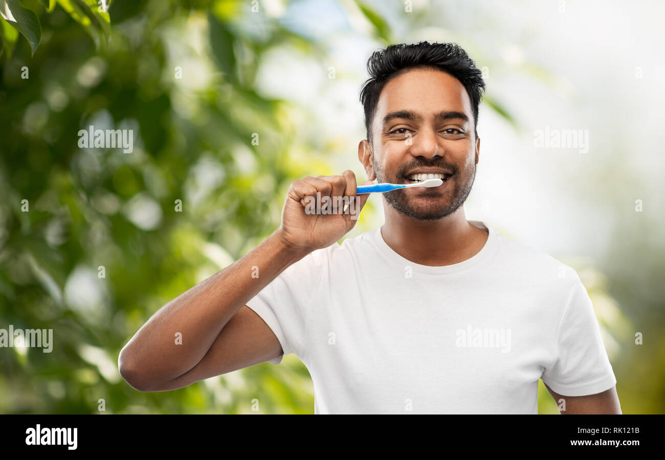 indian man with toothbrush cleaning teeth Stock Photo - Alamy