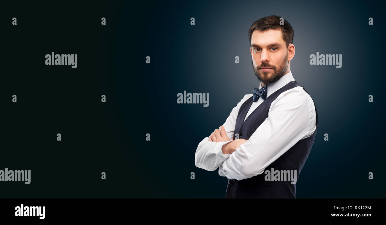 man in shirt and bowtie over black background Stock Photo