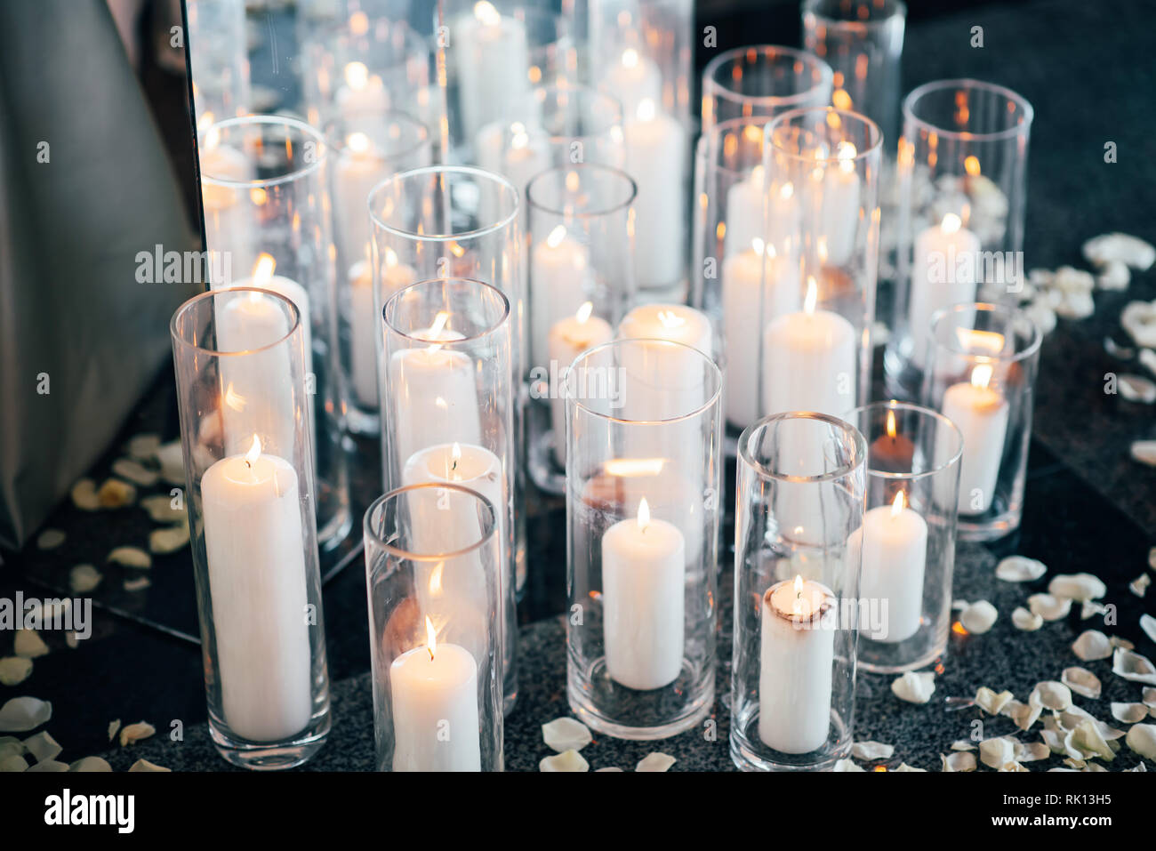 Many candles and flower petals to celebrate the wedding ceremony Stock
