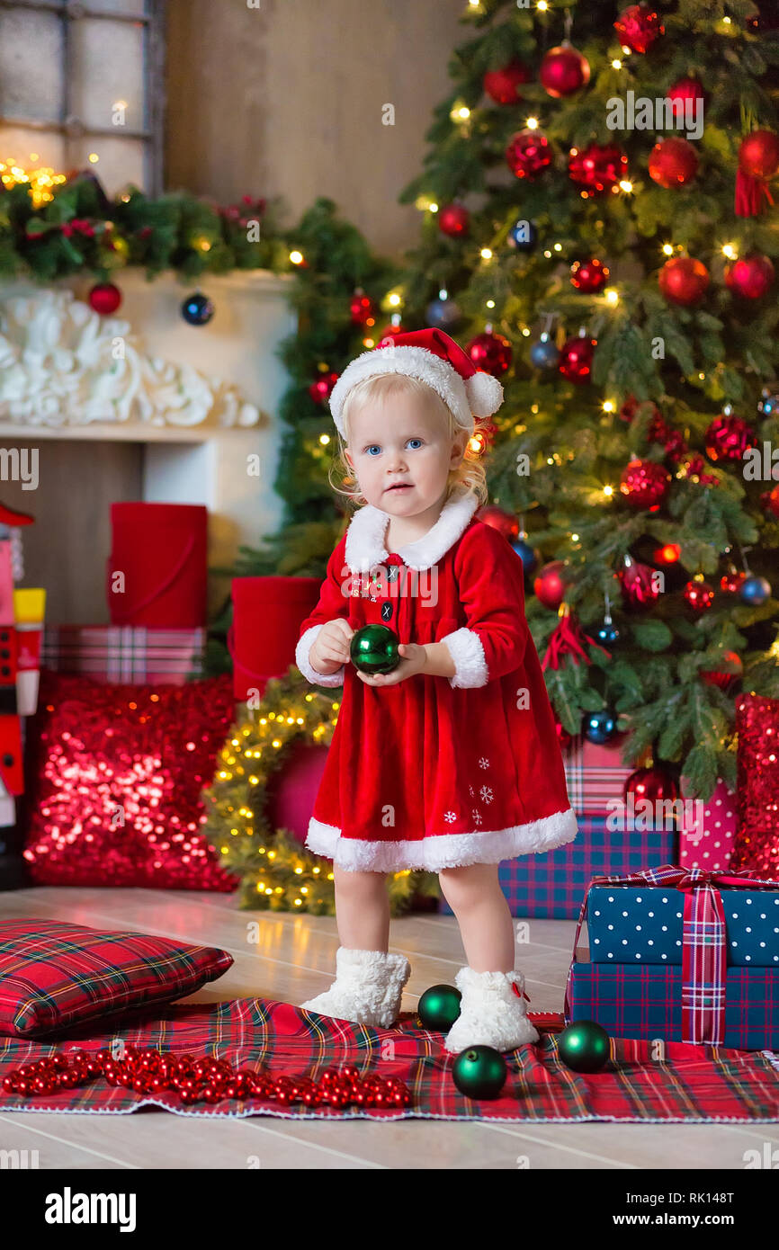 Merry Christmas and Happy Holidays Cute little child girl is