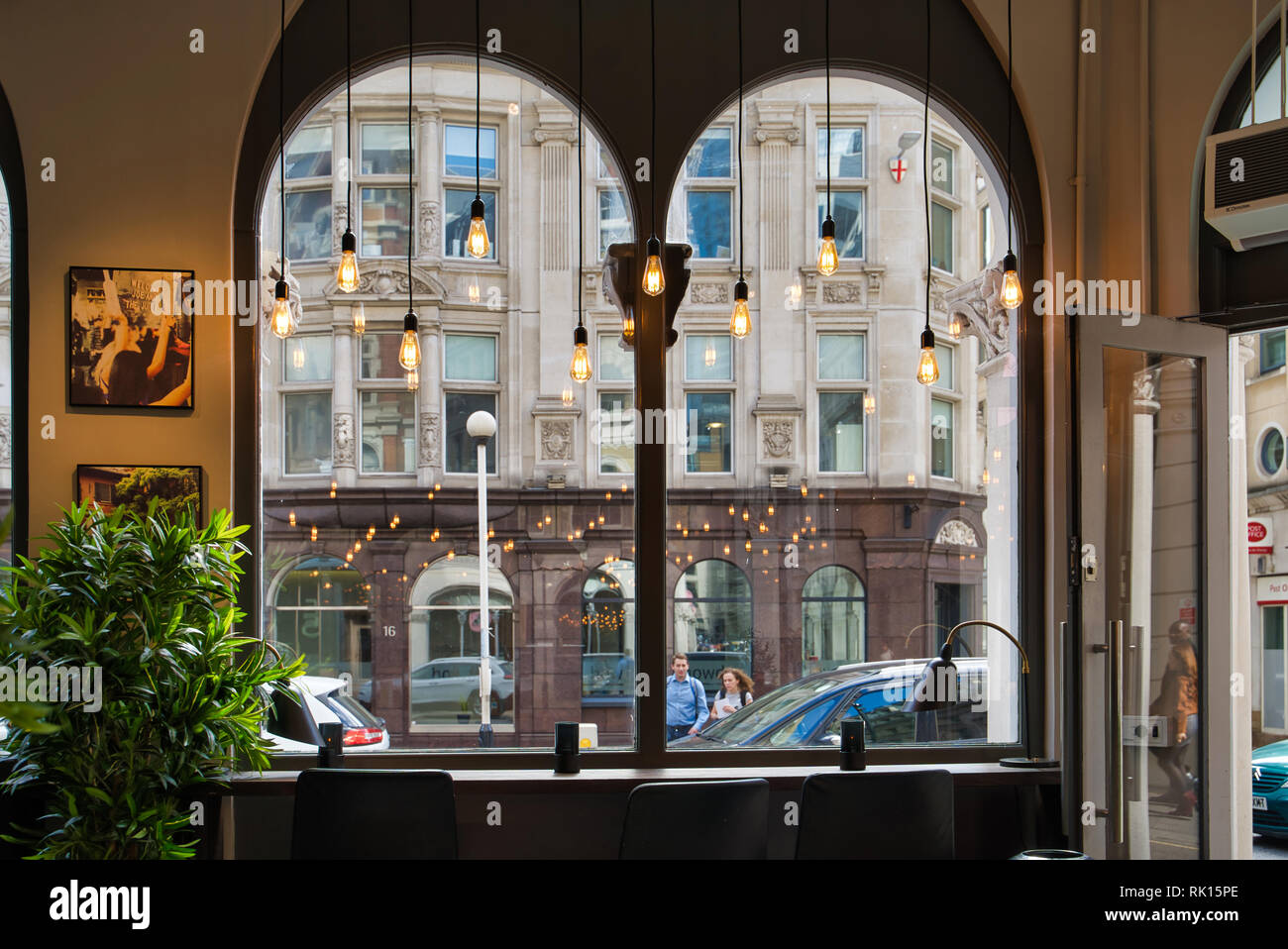 LONDON, UK - SEPTEMBER 9, 2018: interior of a cozy city cafe, large windows overlooking the street Stock Photo