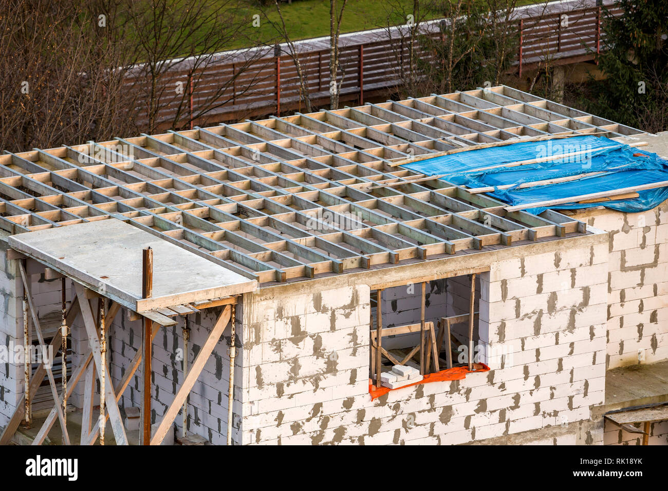 Building under construction. Roof beams frame and roofing underlayment