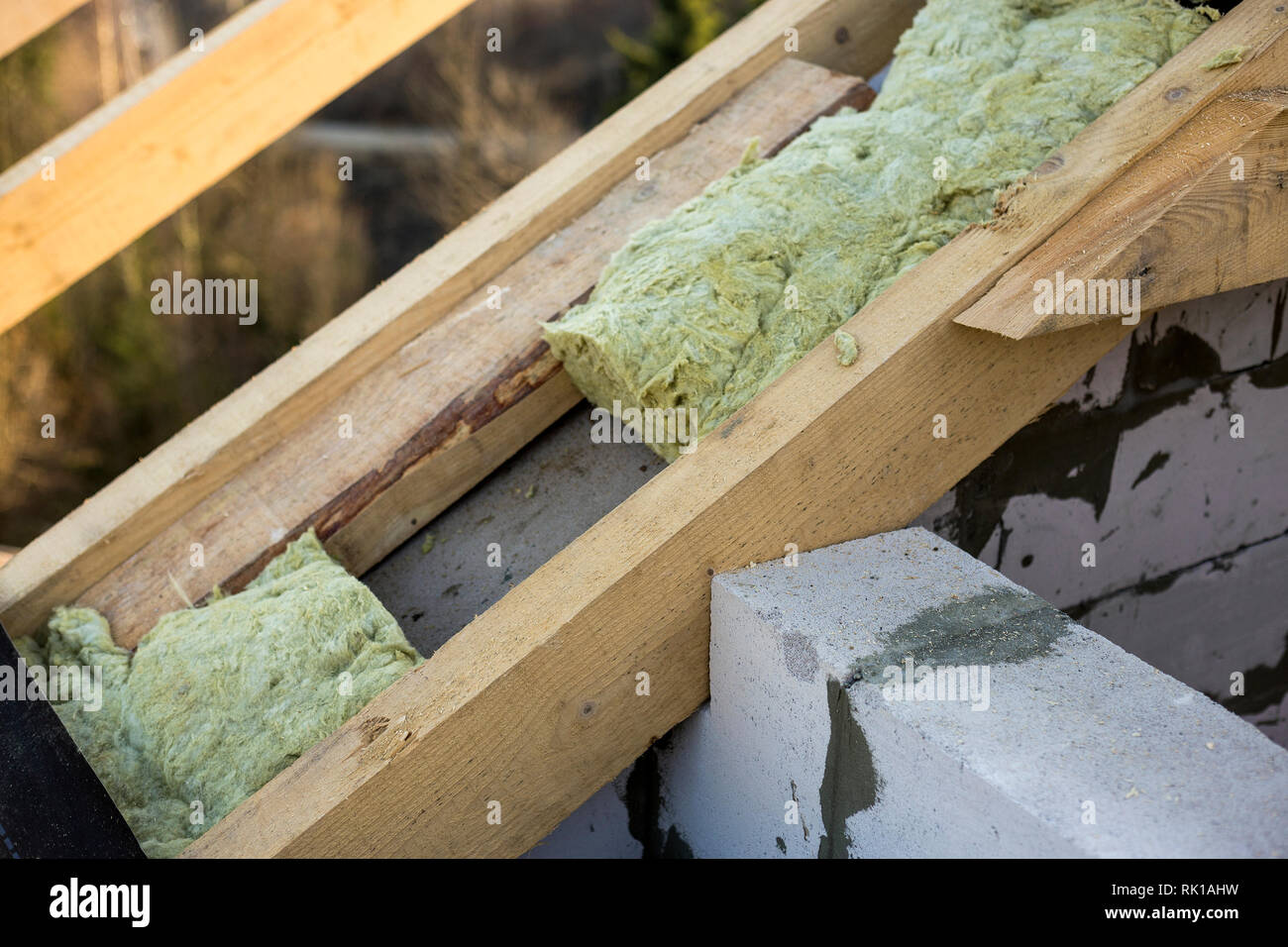 Roof construction and insulation with mineral wool. Wooden beams frame