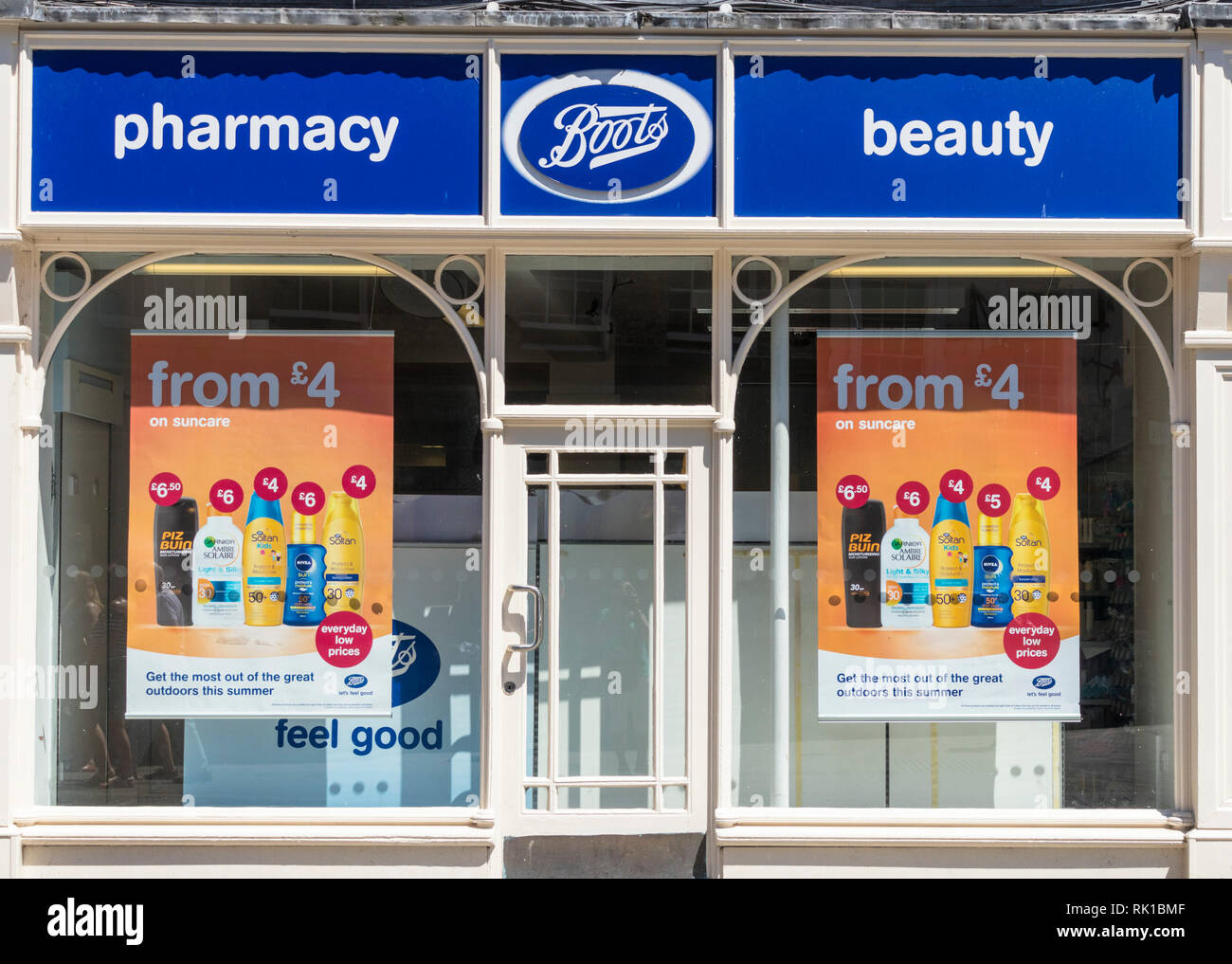 Front window of a city centre branch of Boots the chemist showing special offer posters Kings square York Yorkshire England gb uk Europe Stock Photo