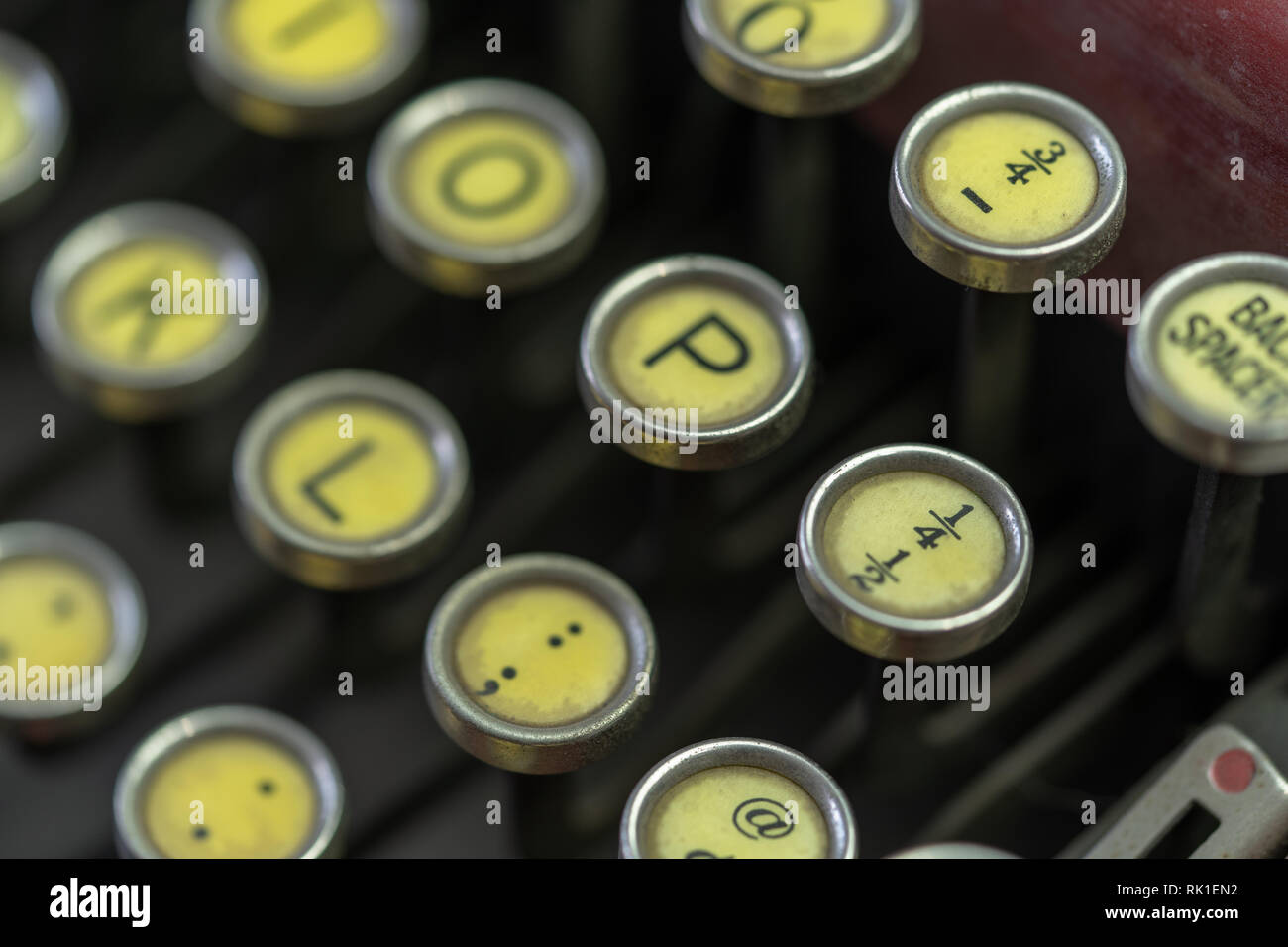 A closeup of the keys on an antique typewriter focusing on the fractional number 1/4. Stock Photo