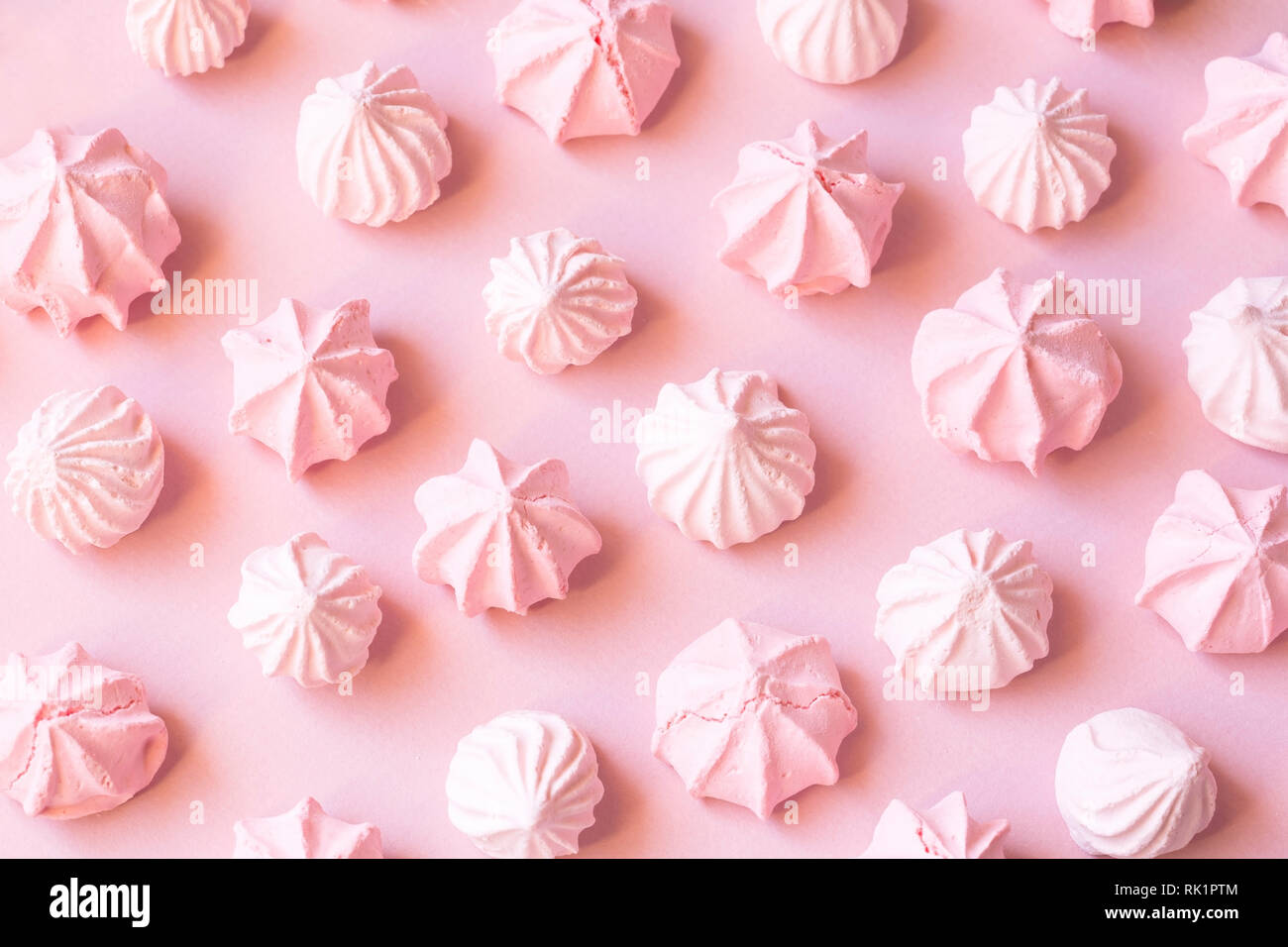 Pink meringues background Stock Photo