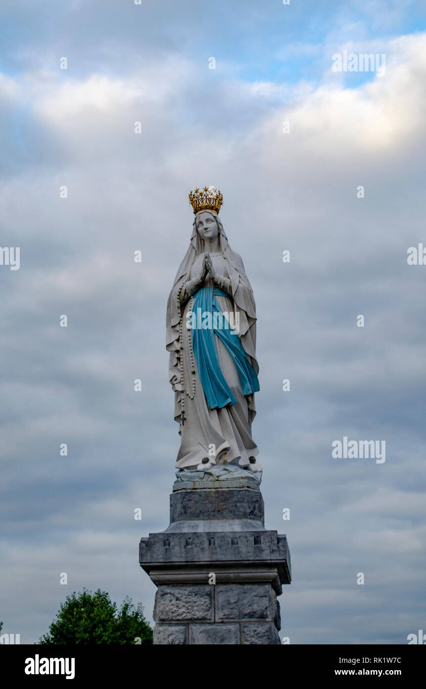 Lourdes, France; August 2013: Statue of Our Lady of Immaculate Conception. Lourdes, France, major place of catholic pilgrimage Stock Photo
