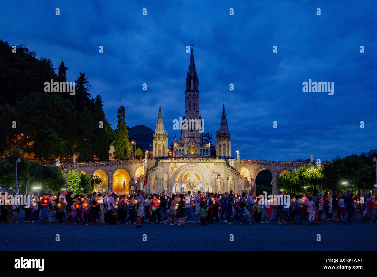 Lourdes, France; August 2013 Pilgrims partaking in La Procession Mariale Aux Flambeaux or the
