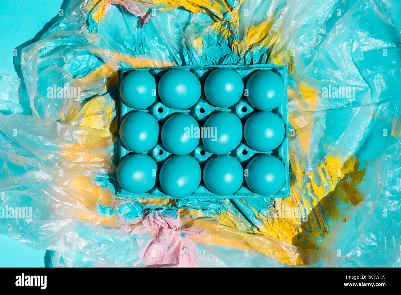 Colourful Easter eggs in rack on cellophane Stock Photo