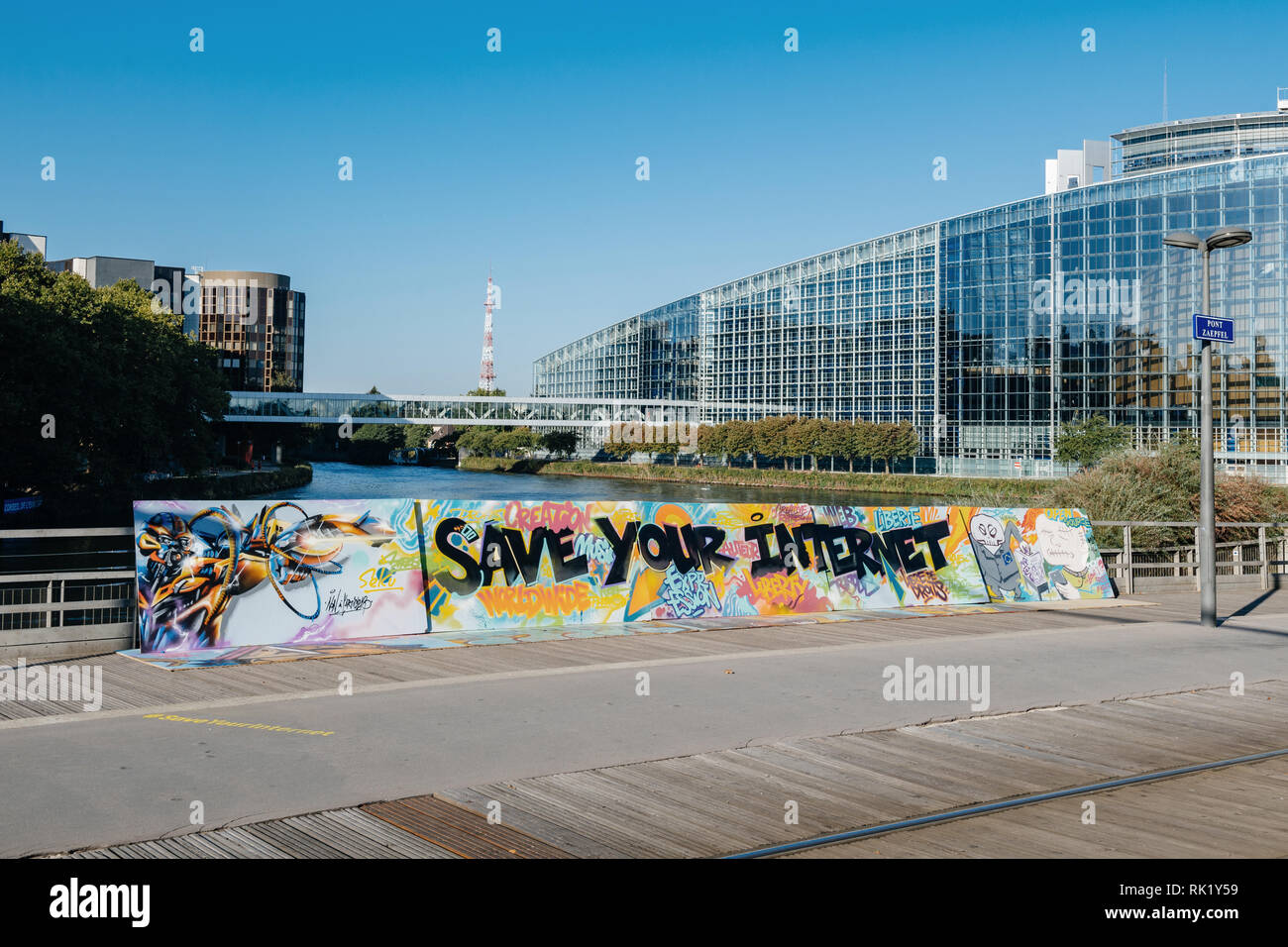 STRASBOURG, FRANCE - SEP 12, 2018: large protest banner Save Your Internet with European parliament in the background on Pont Zaepfel bridge Stock Photo