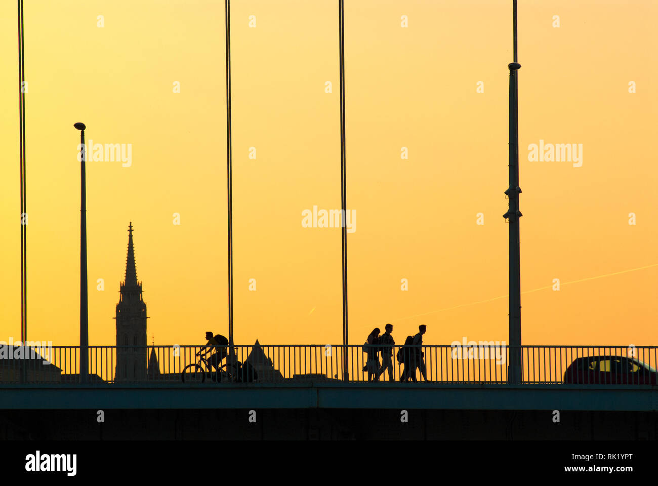 Silhouettes of people crossing the bridge Stock Photo - Alamy