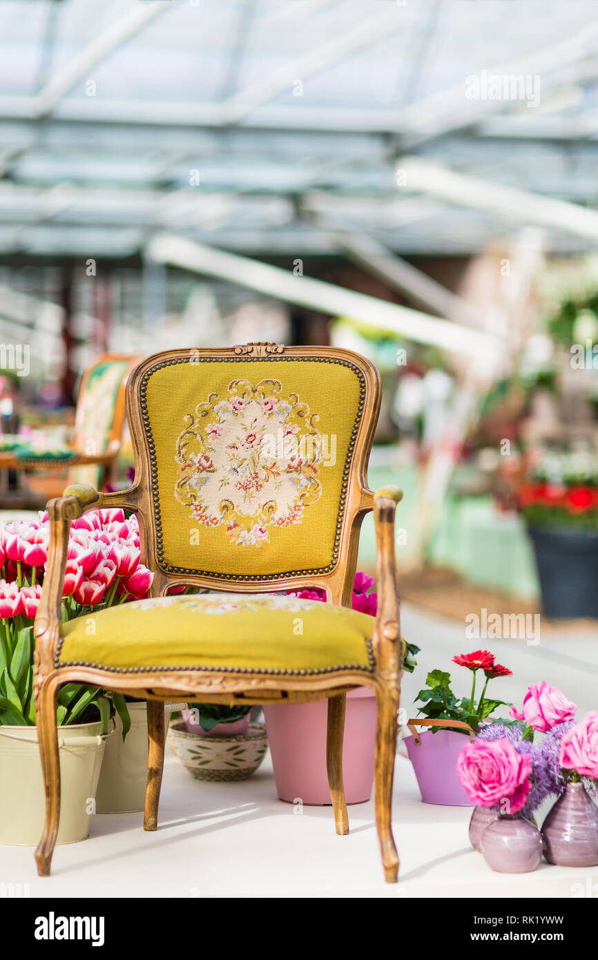 Wooden Arm Chair With Yellow Fabric Upholstery And Flowers