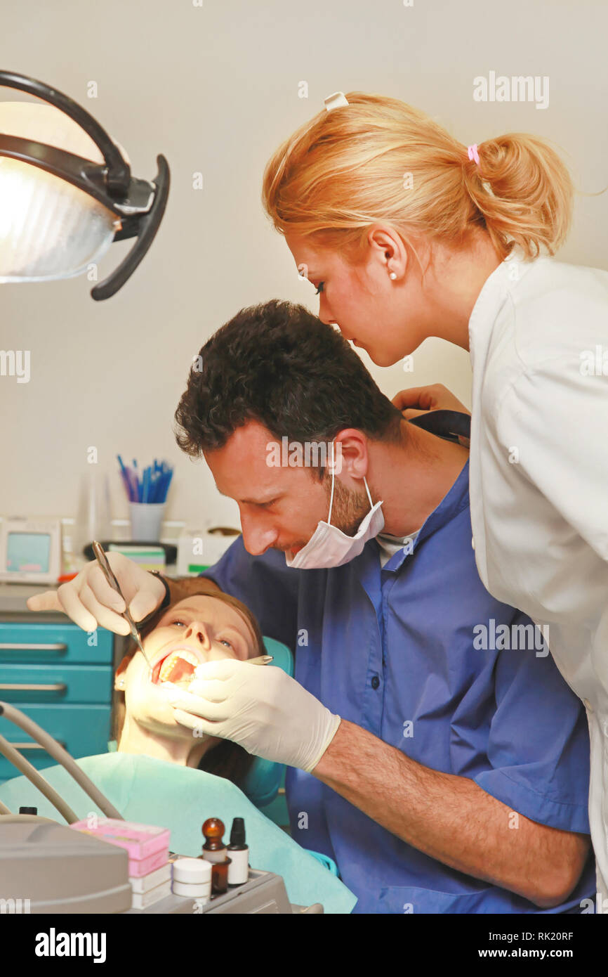 Dentists consultations during exam in dental clinic Stock Photo Alamy