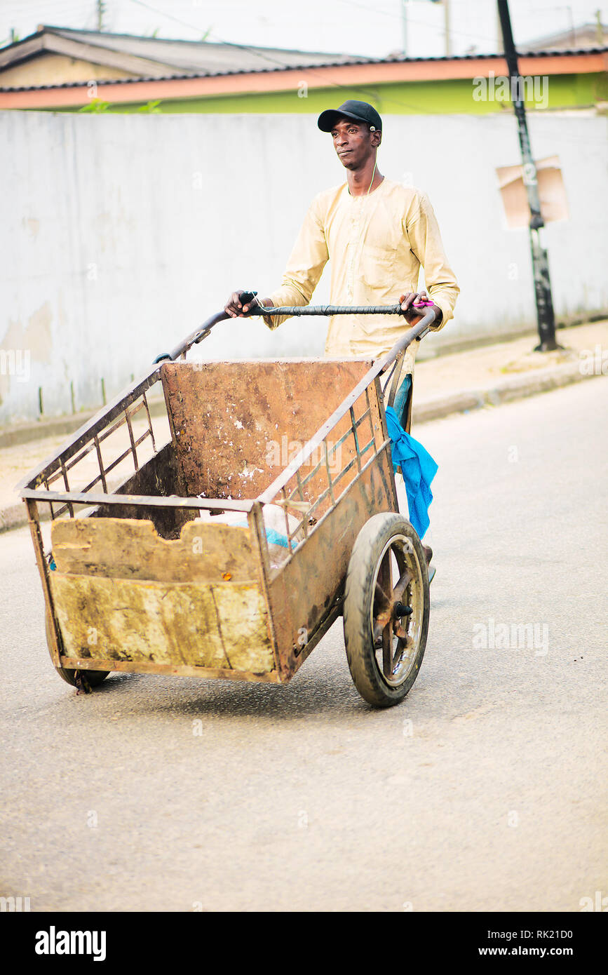 Urban jobs A scavenger in the streets of Lagos with his cart Stock