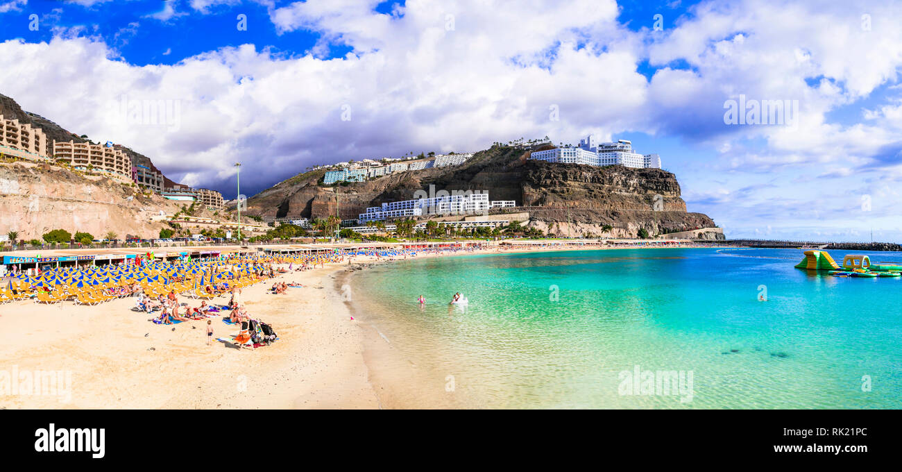 Beautiful Playa de los Amadores,view tourquise sea and mountains,Gran Canaria,Spain. Stock Photo
