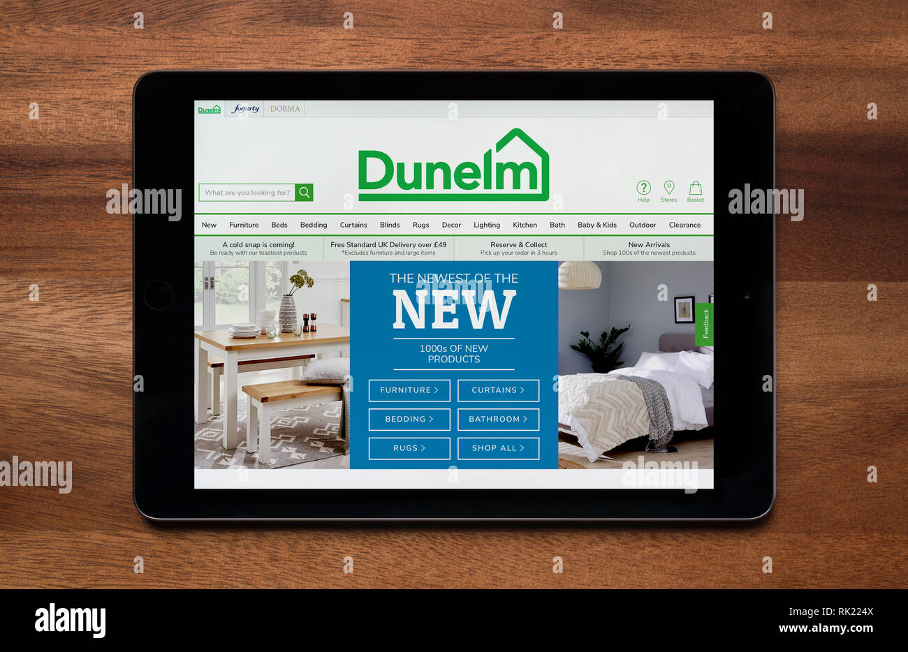 The website of Dunelm is seen on an iPad tablet, which is resting on a