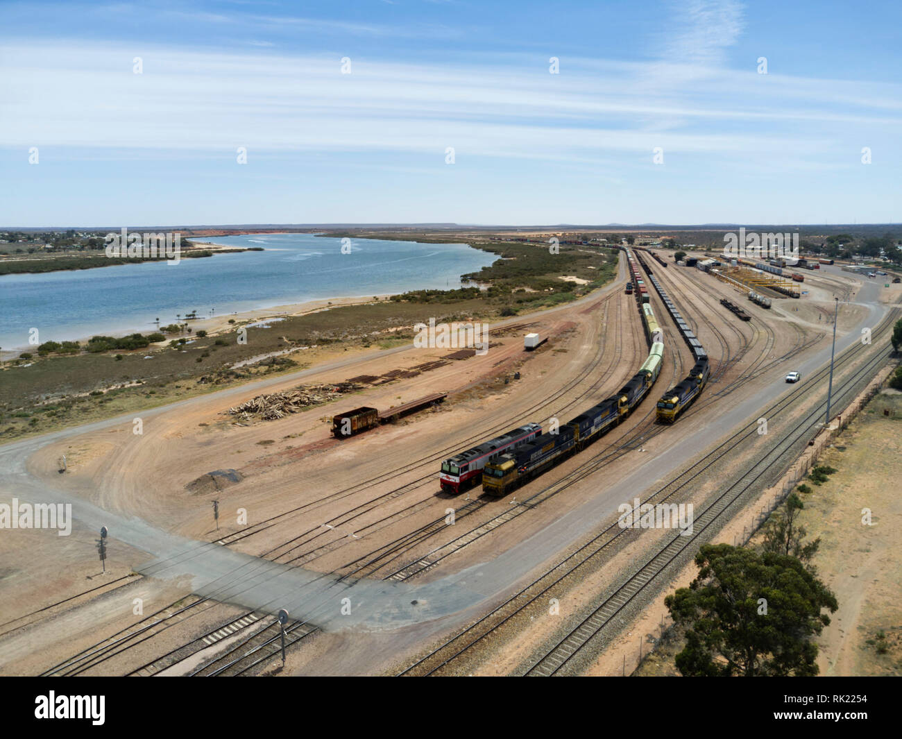 Aerial of freight train leaving Spencer Junction Rail Yard Port Augusta South Australia Stock Photo