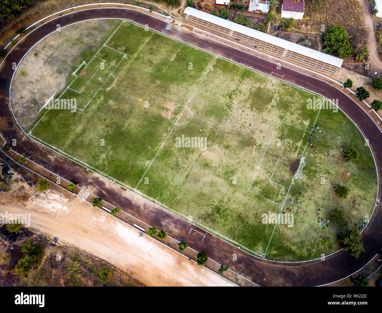 aerial view of rural soccer field stadium in latin America Guatemala