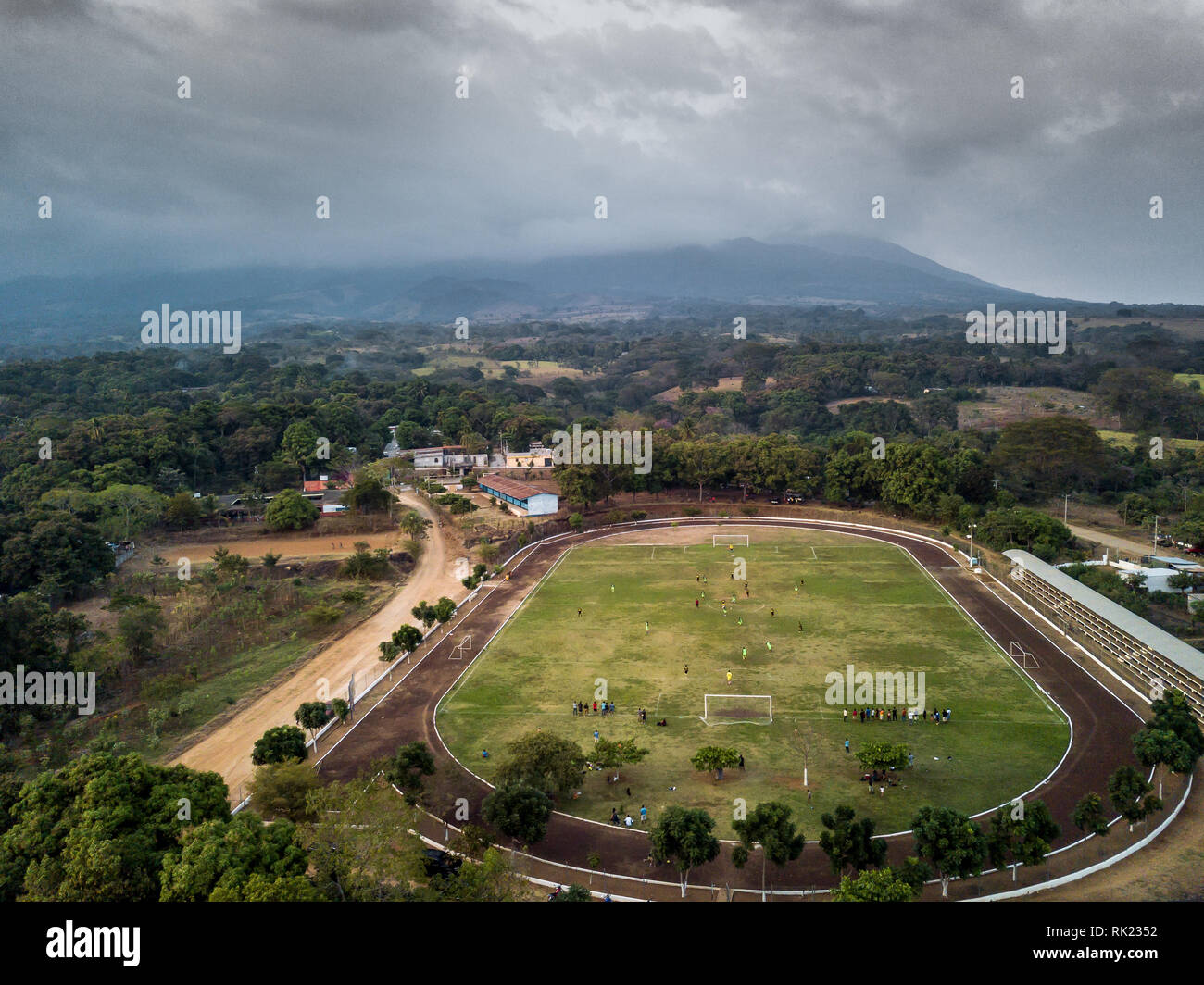 aerial view of rural soccer field stadium in latin America Guatemala