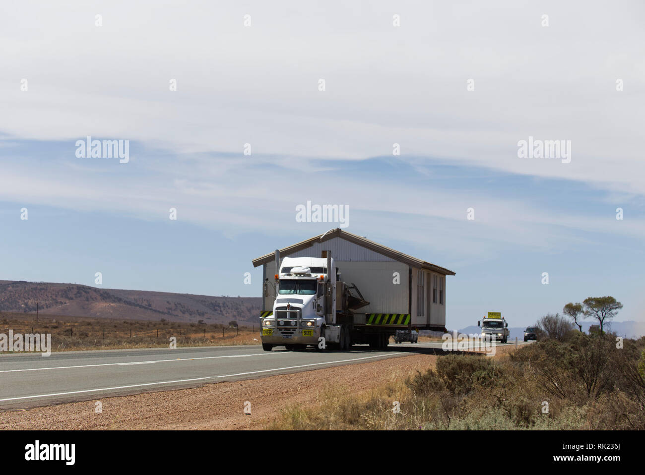 Wide load house being transported by semi trailer truck near Port Augusta South Australia Stock