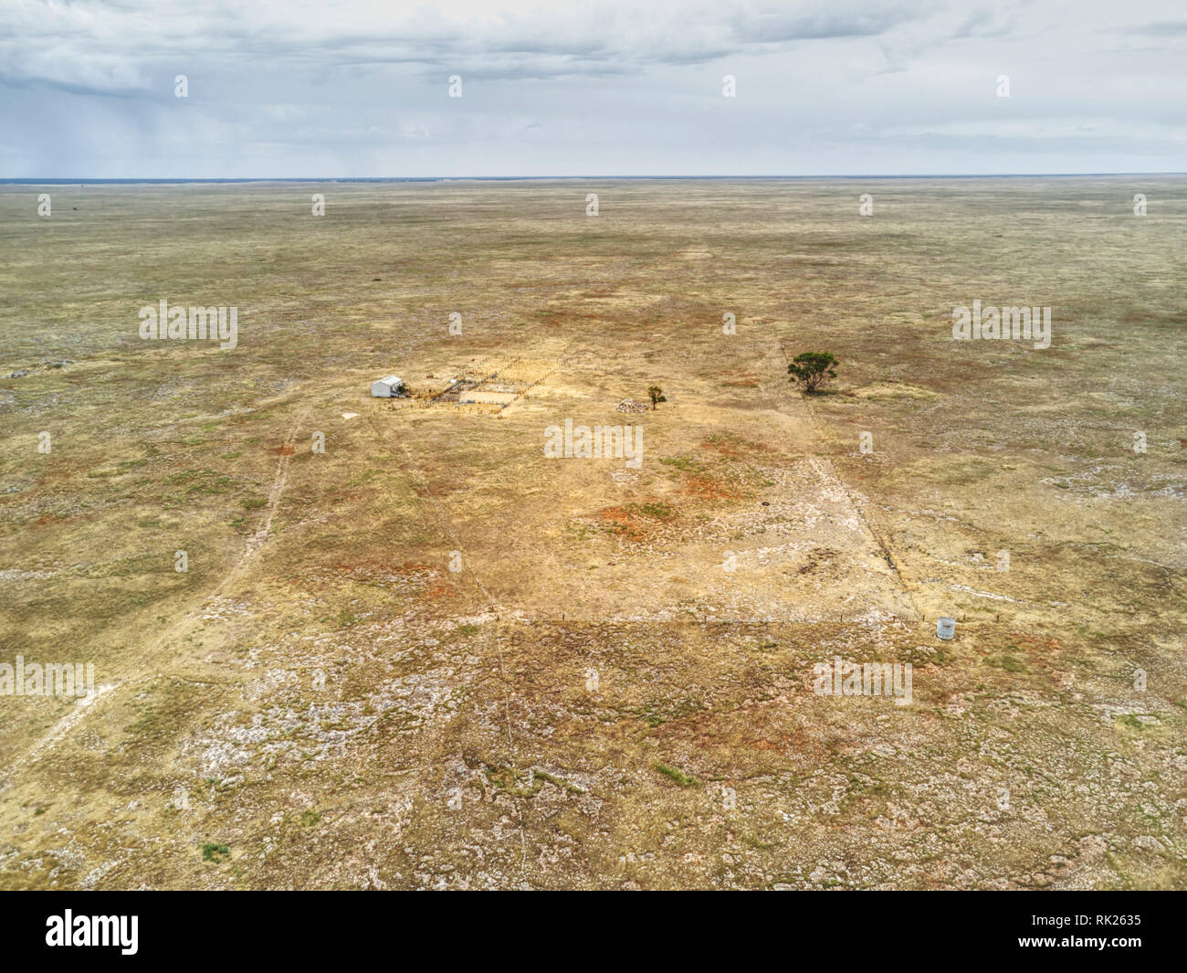 Aerial view of a shearing shed surrounded by rocky barren ground that was once  so densely vegetated that the name 'No Where Else' came about when the Stock Photo