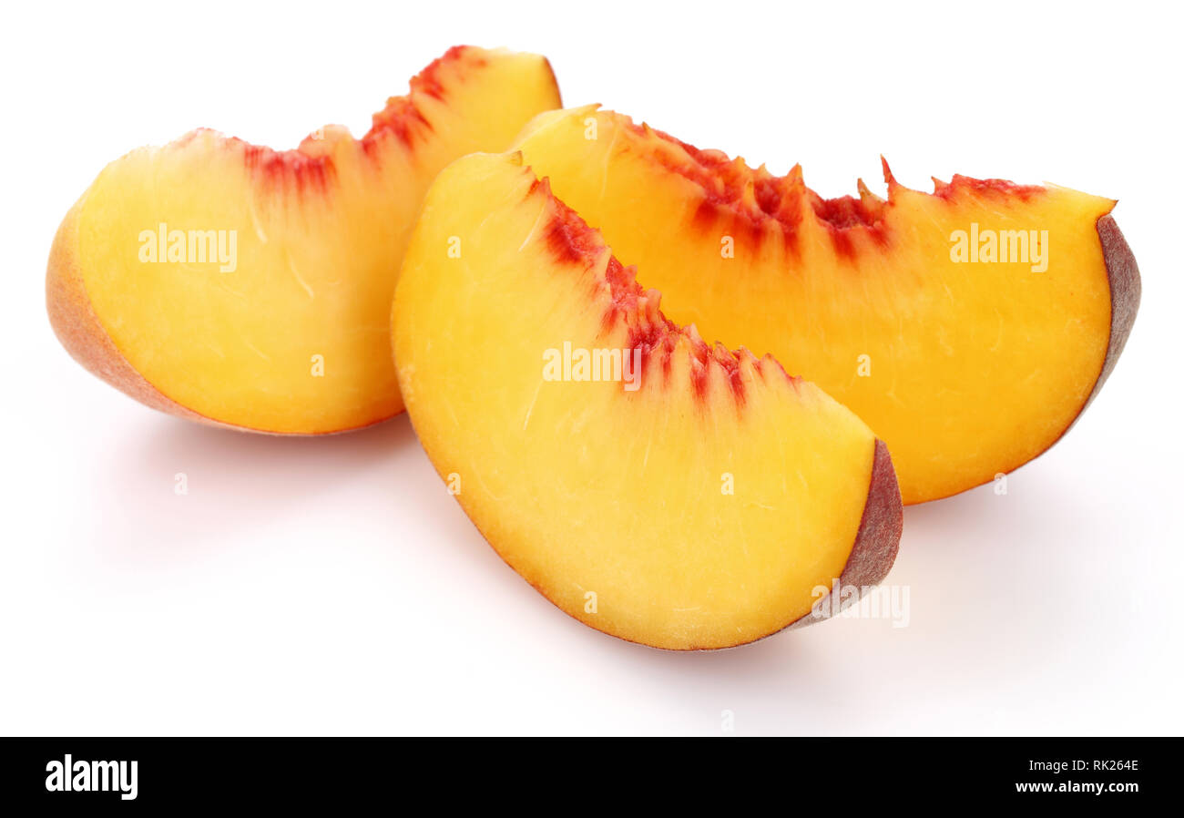 Ripe peach slices isolated on white background Stock Photo - Alamy