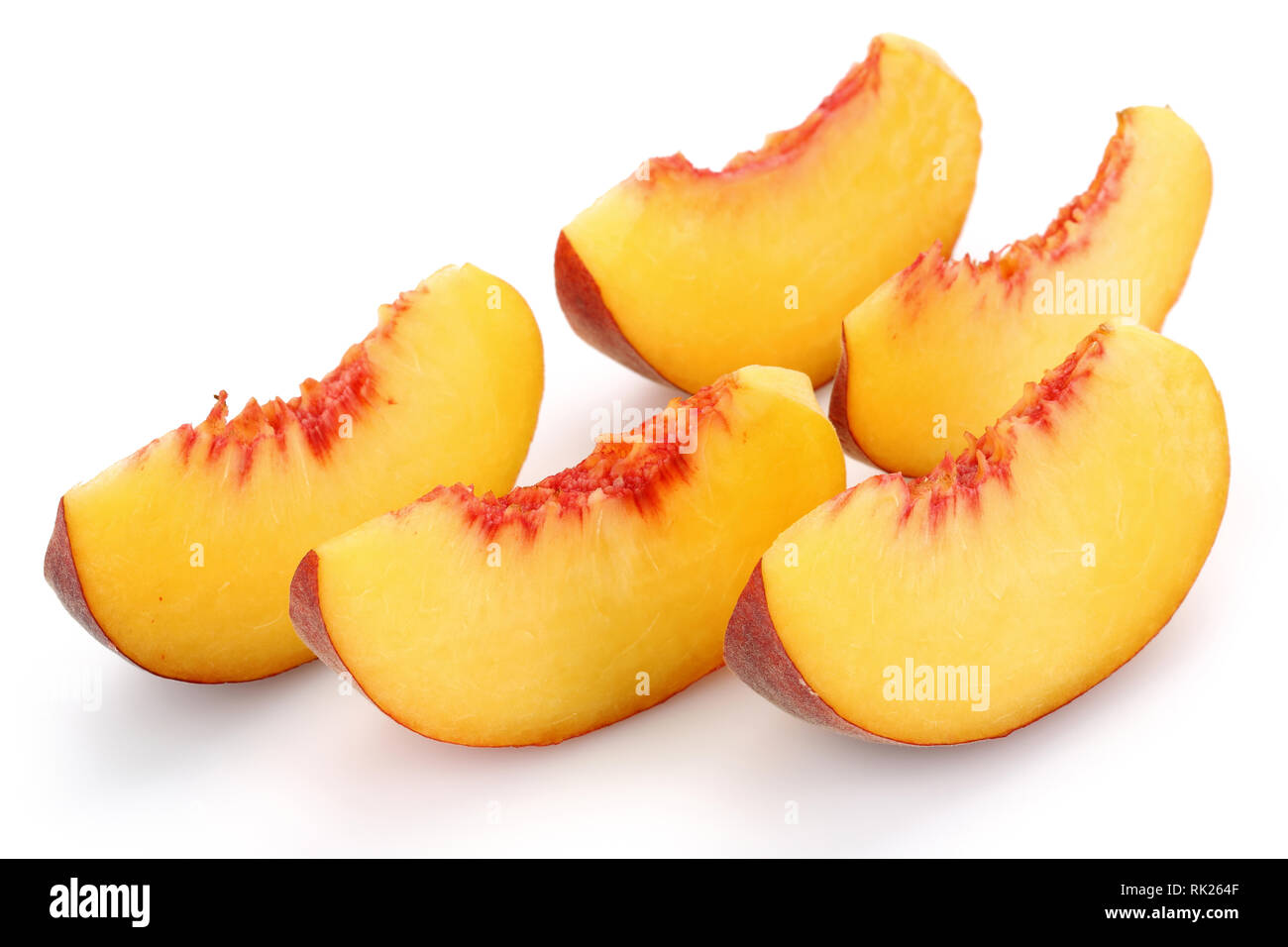 Ripe peach slices isolated on white background Stock Photo - Alamy