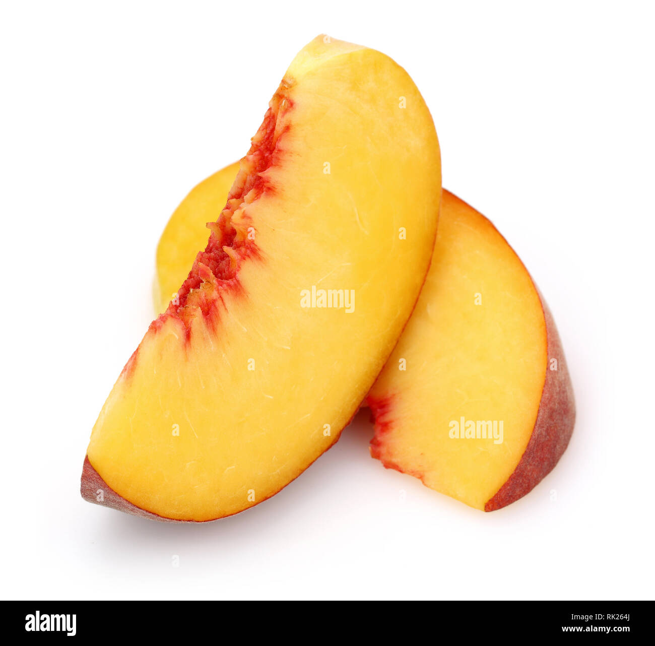 Ripe peach slices isolated on white background Stock Photo - Alamy