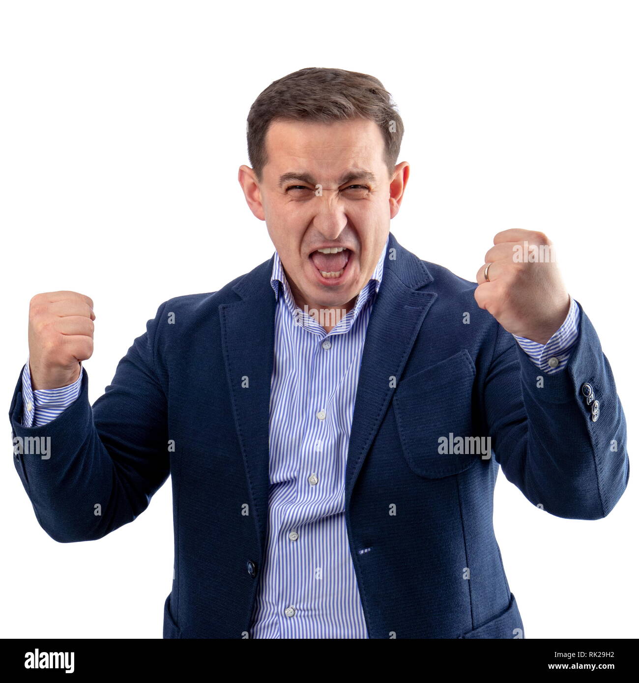 Businessman enjoying himself and shouting after a winning and successful business fight Stock Photo